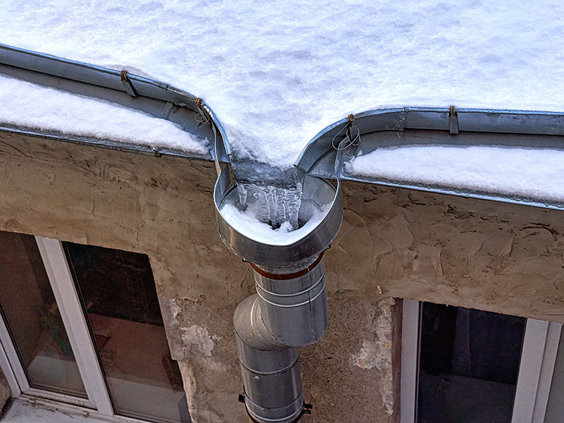 Common water damage in the winter results in frozen drain pipes.